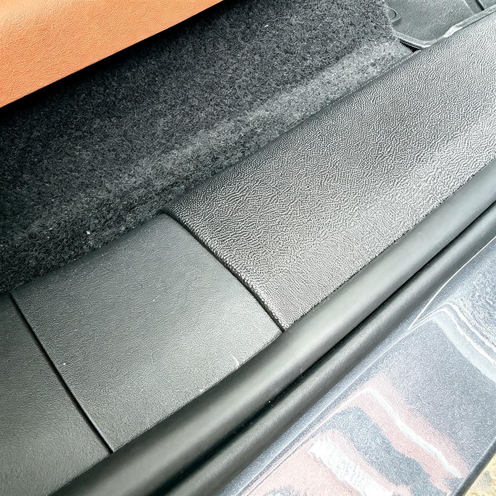 Black textured protective door sill plate for BYD car interior protection.