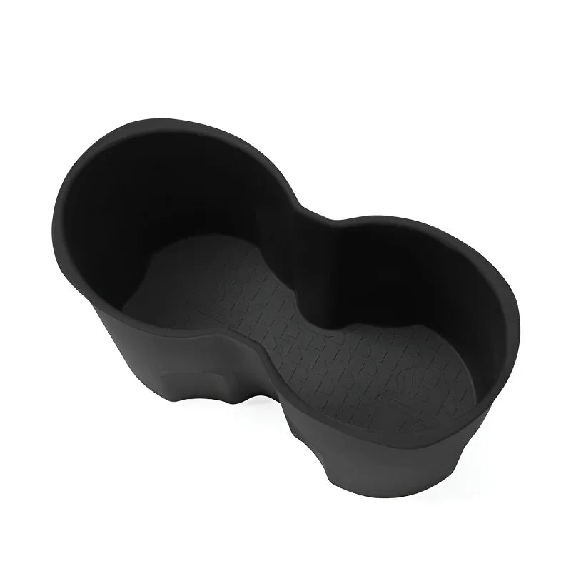 Durable black rubberized car trunk mat with textured non-slip surface for spill protection.