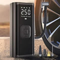 Portable black digital tire inflator with LED display and multiple nozzle attachments.