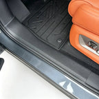 Black heavy-duty TPE custom-fit floor mats protecting the vehicle interior footwell.