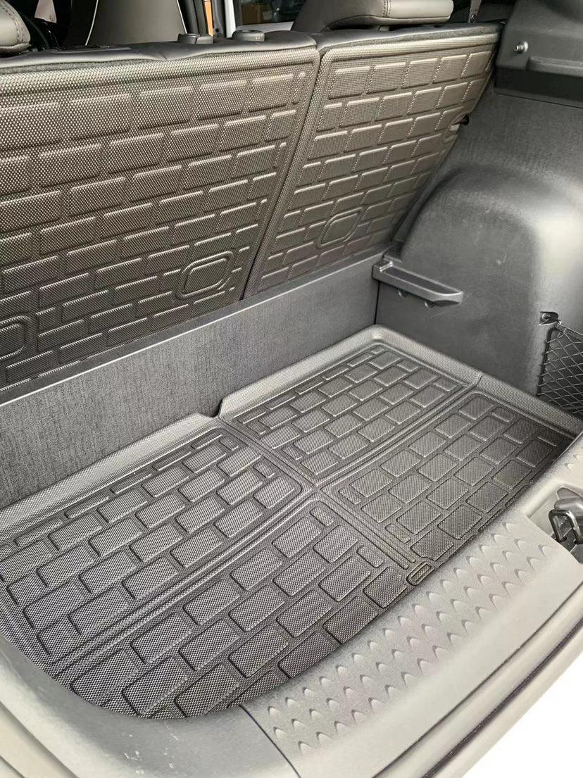 Black heavy-duty TPE waterproof trunk mat with textured anti-slip pattern for BYD car interior.