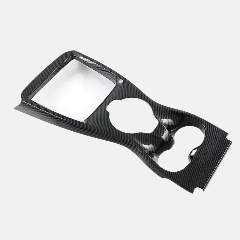 Black carbon fiber patterned interior trim panel for BYD vehicle console.