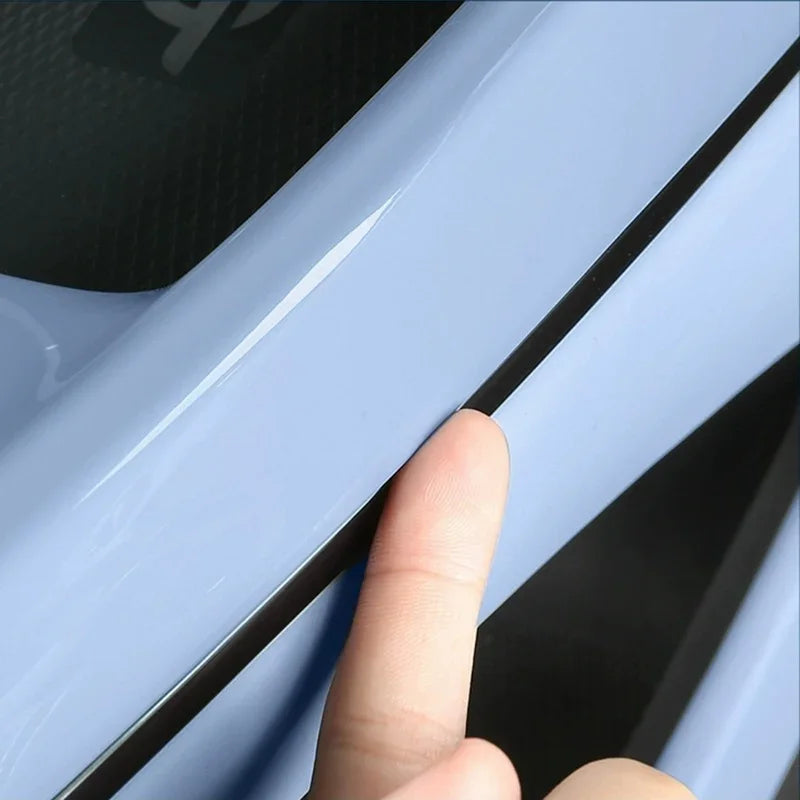 Light blue car door edge protector strip with sleek black trim detail.