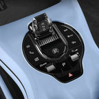 Crystal gear shifter and black control panel on a light blue BYD interior console.