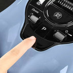 A person's finger pressing the sleek black glossy center console control panel of a BYD vehicle.