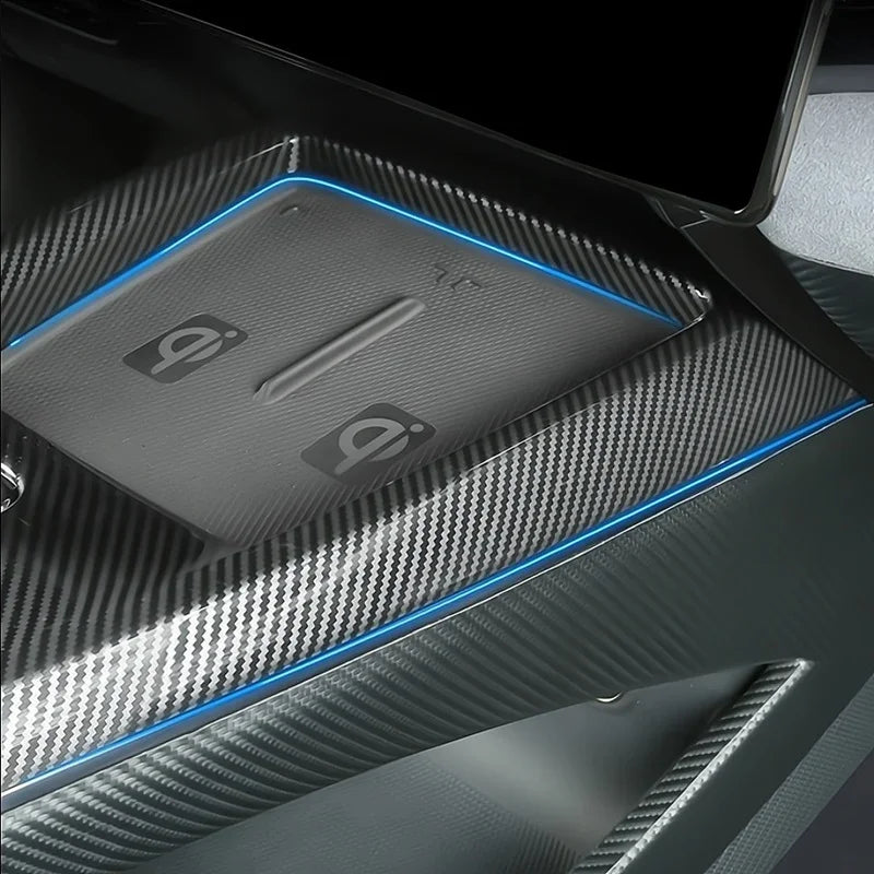 Premium grey carbon fiber texture center console tray with sleek blue trim accents.