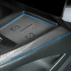 Premium grey carbon fiber texture center console tray with sleek blue trim accents.