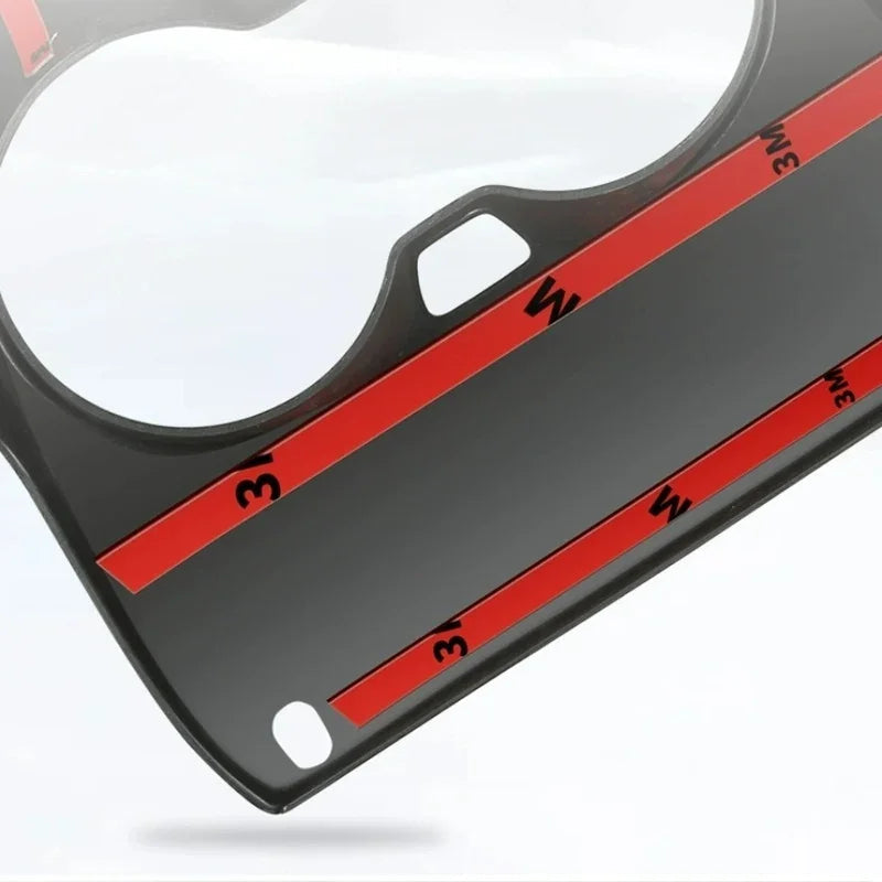 Black car accessory tray featuring red 3M adhesive strips for secure installation.