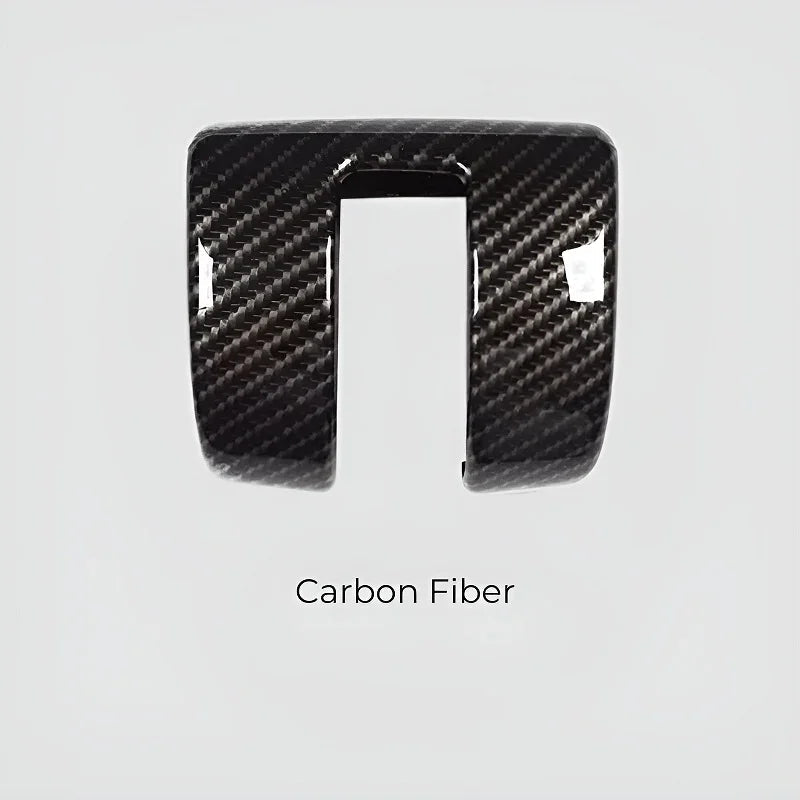 Professional carbon fiber automotive interior trim piece in a glossy black finish