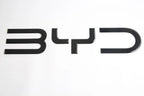 Glossy black BYD emblem badge made of premium durable material for car exterior styling.