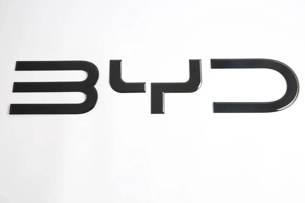 Glossy black BYD emblem badge made of premium durable material for car exterior styling.