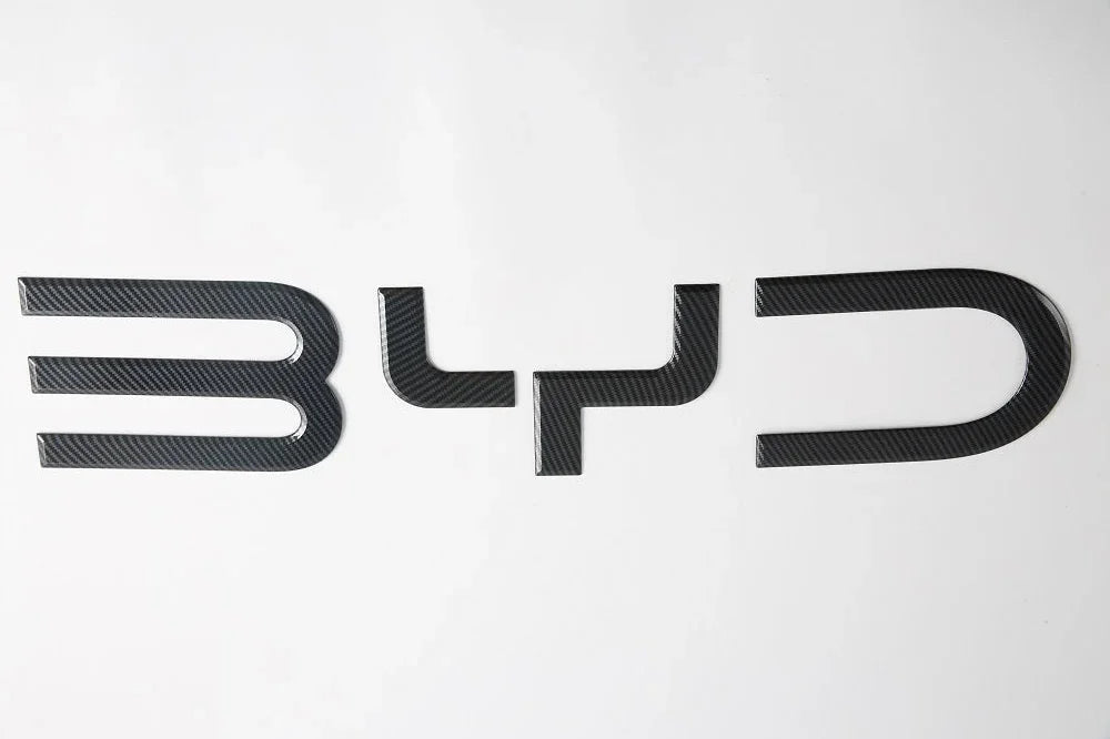 Black carbon fiber texture BYD emblem badge for premium car exterior styling.