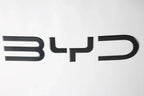 Black carbon fiber texture BYD emblem badge for premium car exterior styling.