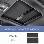 Two-piece black leather-textured adhesive sunroof sunshade for car interior protection.