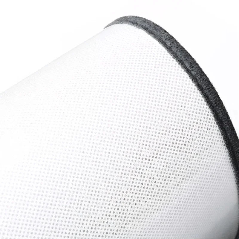 White perforated leather texture with a sleek black edge detail.