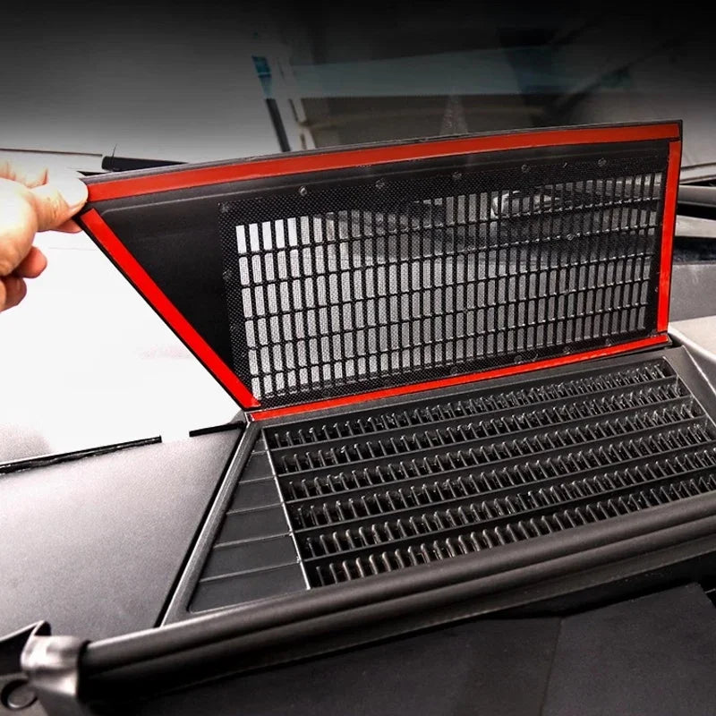 Black mesh protective screen with a vibrant red trim for car interior component protection.