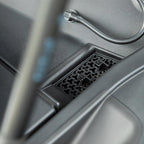 Black textured plastic storage tray and organizer compartment for vehicle interior.