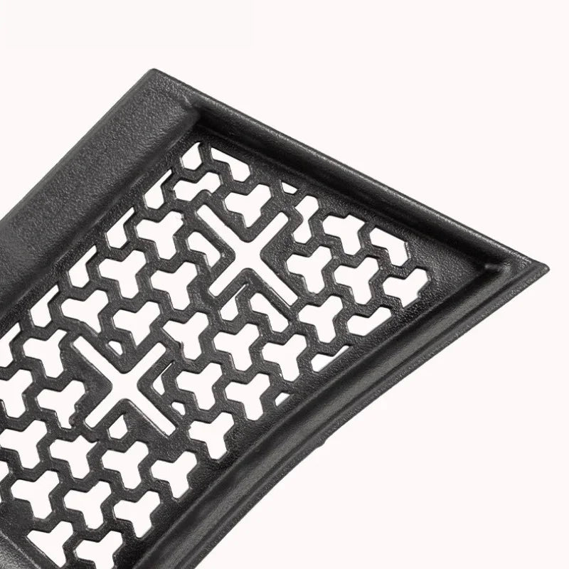 Close-up of a durable black textured rubber car floor mat with a unique honeycomb pattern.