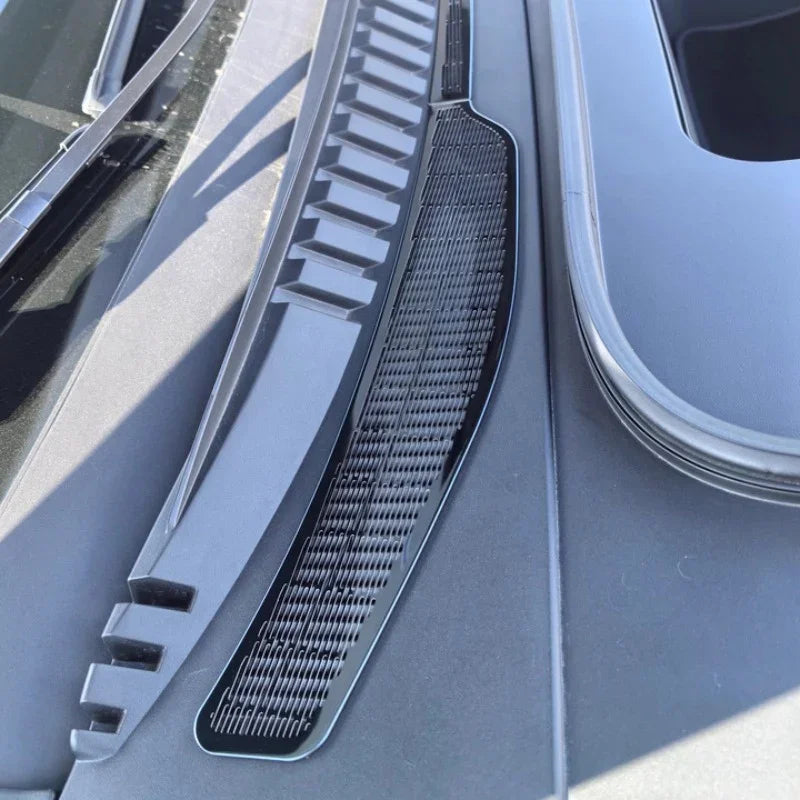 Close-up of a matte black durable plastic cowl cover vent for a BYD vehicle.