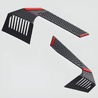 Two matte black plastic car accessories with red accents and perforated textures.