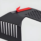 Close-up of a black matte metal car accessory featuring a red adhesive strip.