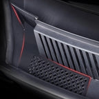 Black textured plastic car interior storage tray with integrated red ambient LED lighting.