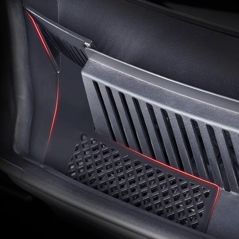 Black textured plastic car interior storage tray with integrated red ambient LED lighting.