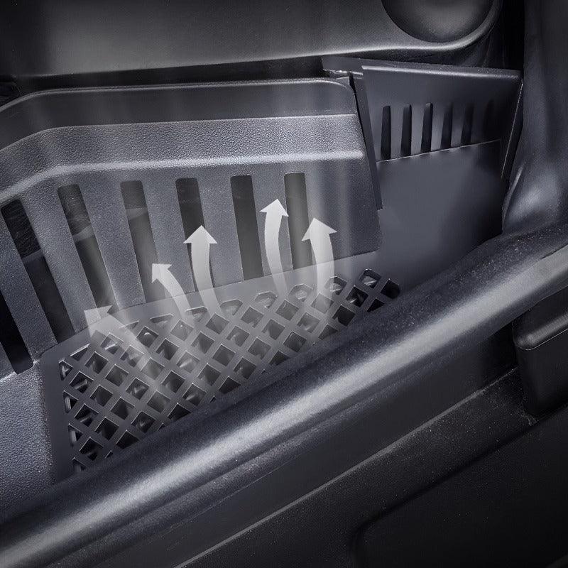 Close-up of black durable plastic car floor mat featuring a breathable grid design for ventilation.