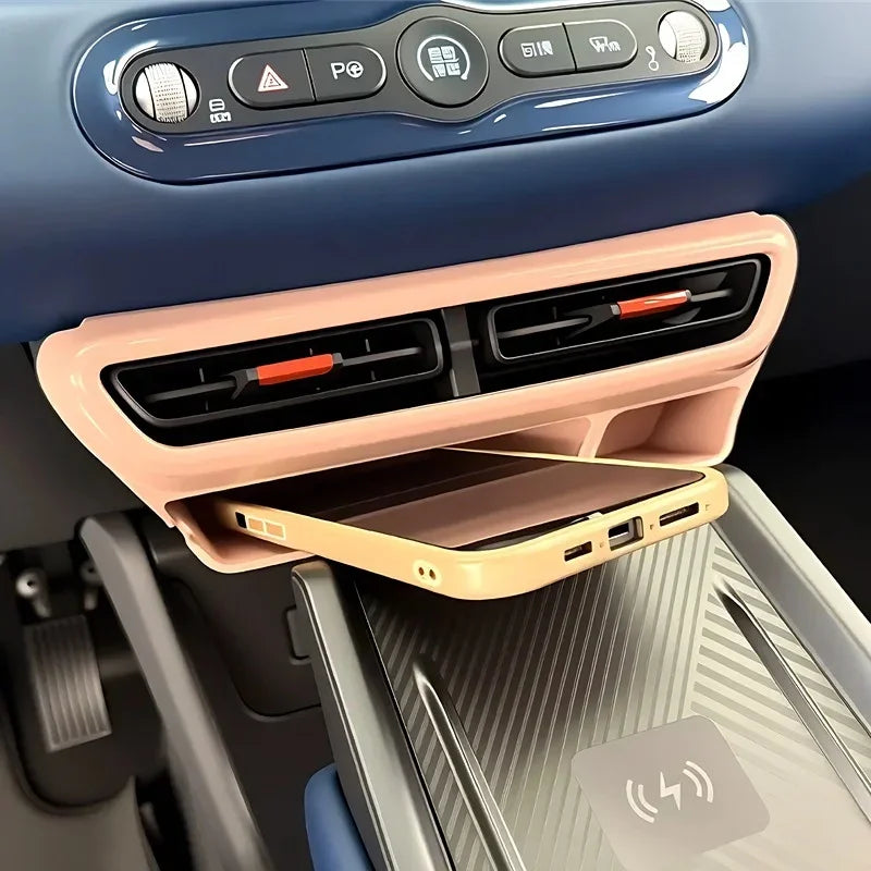 Pink ABS plastic phone holder mounted under the car dashboard vents