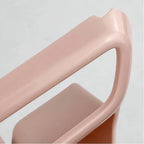 Close-up of a sleek, light pink durable plastic handle with a smooth matte finish.