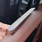 Silver metallic patterned air vent cover for car interior protection.