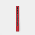Red textured car door sill protector with black carbon fiber pattern inlay.