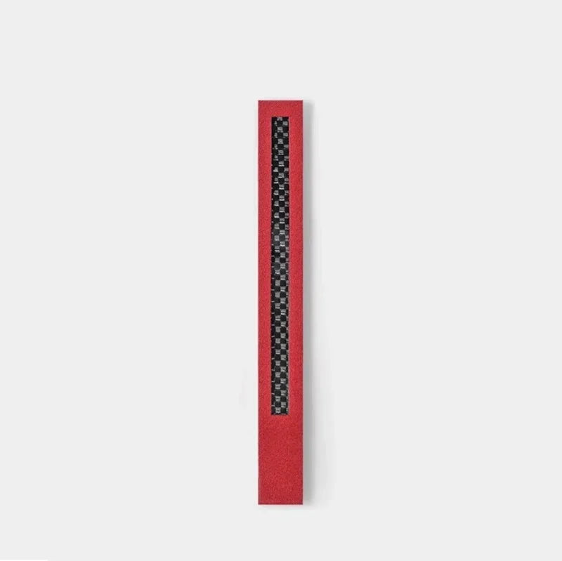 Red textured car door sill protector with black carbon fiber pattern inlay.
