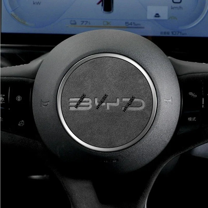 Black textured leather steering wheel cover with a sleek silver metallic trim ring.