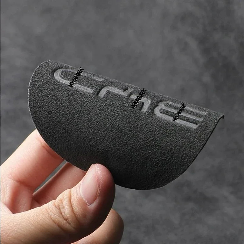 Black textured anti-slip protective pad with embossed lettering for BYD car interior.