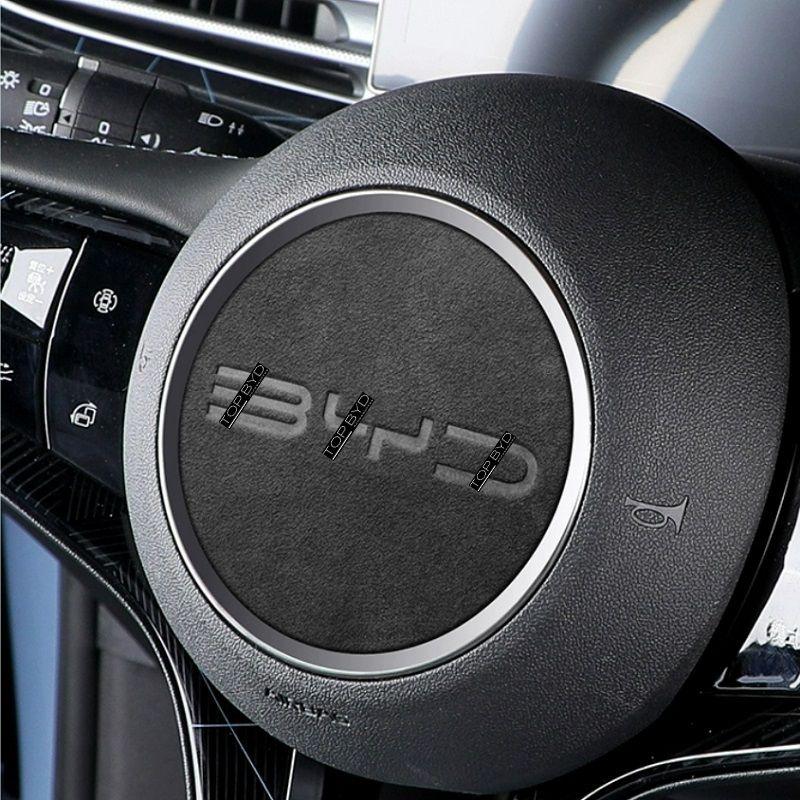 Black textured leather steering wheel cover with a sleek silver metallic trim ring.