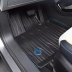 Black textured TPE car floor mat with stylish blue edge stitching for BYD protection.