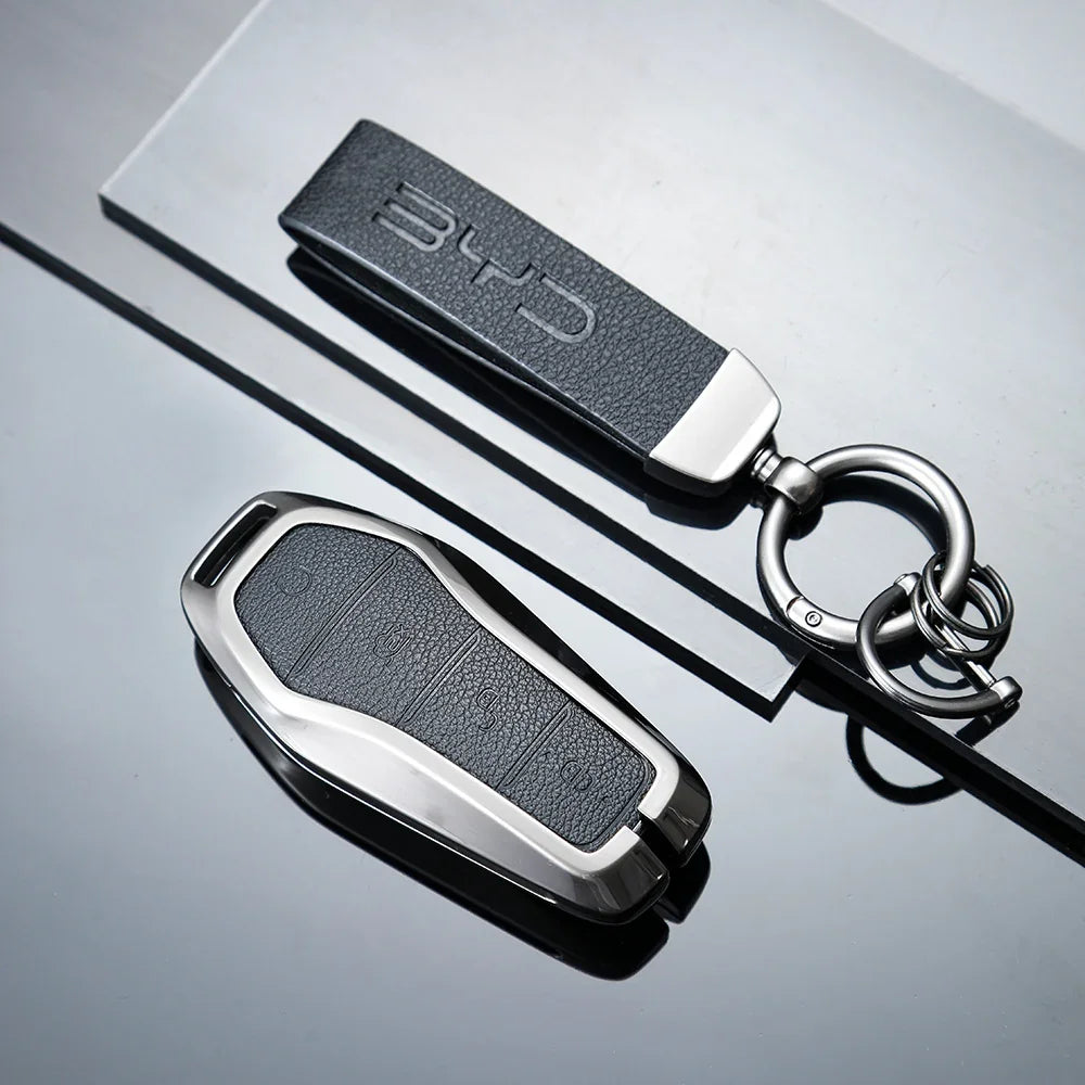 Premium black textured leather key fob cover with sleek silver metallic trim for BYD car keys.