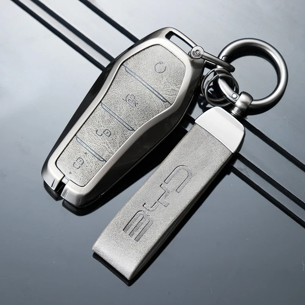 Premium metallic silver key fob cover and matching leather-textured keychain for BYD.