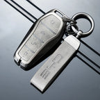 Premium metallic silver key fob cover and matching leather-textured keychain for BYD.