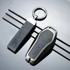 Premium black leather car key fob cover with silver metal trim and embossed BYD logo.