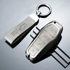 Premium grey leather and metallic BYD car key fob cover with elegant textured finish.