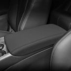Black premium leather center console armrest cover with precise white contrast stitching.