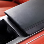 Black premium leather center console armrest cover with precise stitching for BYD interior.