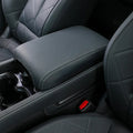 Premium dark grey leather center console armrest with white contrast stitching for BYD interior.