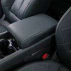 Premium dark grey leather center console armrest with white contrast stitching for BYD interior.