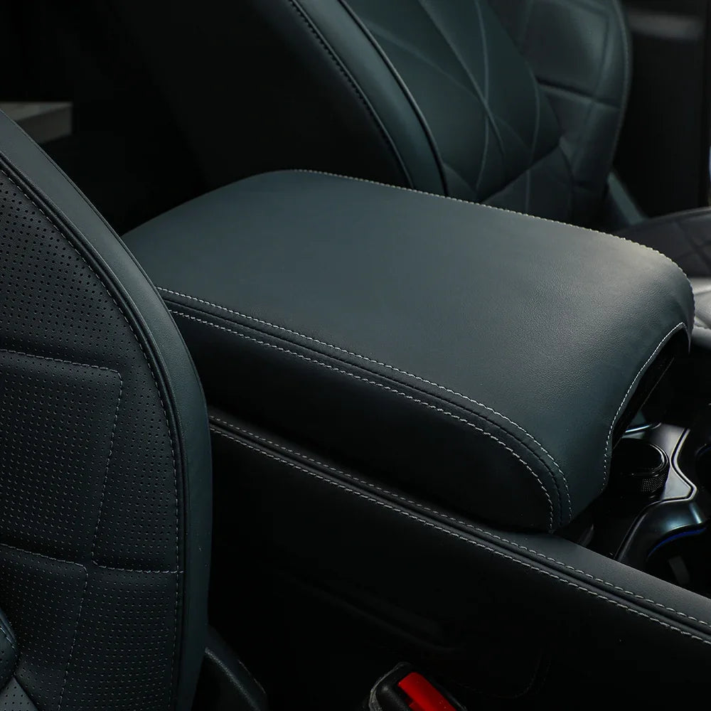 Black leather center console armrest cover with white contrast stitching for BYD vehicles