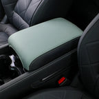 Light sage green leatherette center console armrest cover with white stitching for car interior protection