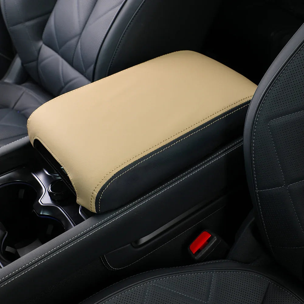 Tan PU leather center console armrest cover with contrast black stitching for BYD car interior.