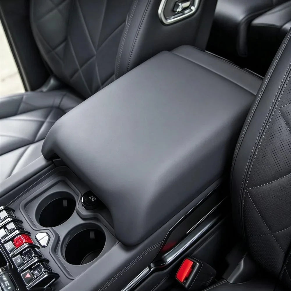 Premium black leather center console armrest with diamond-stitched interior trim.
